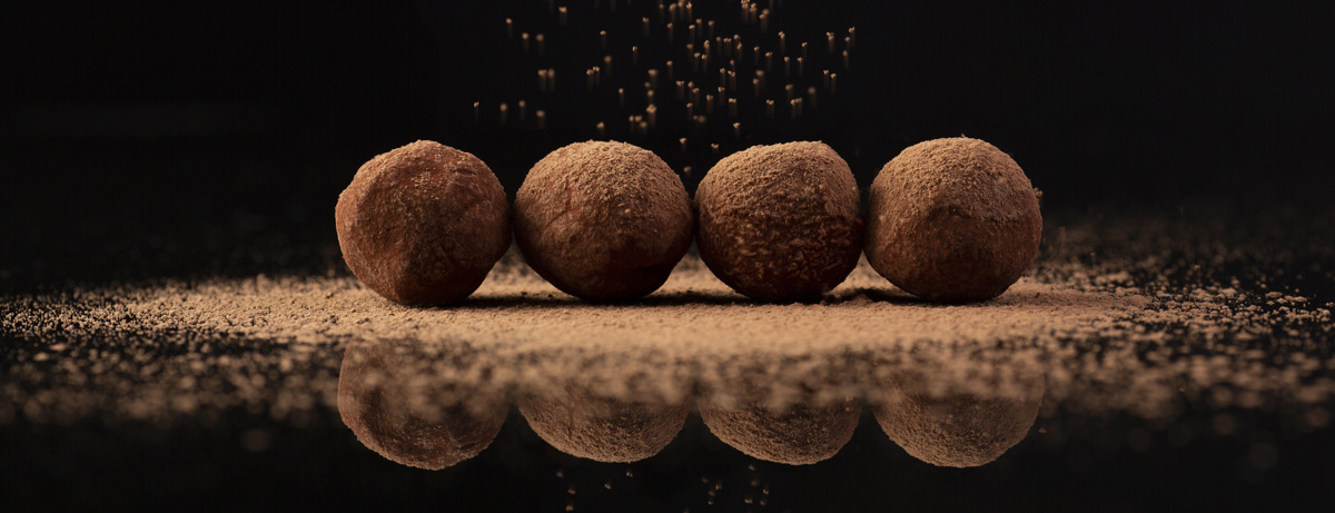 Chocolate truffles properly decorated with cocoa powder